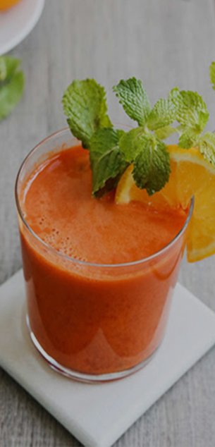 Fresh orange mint drink on wooden table